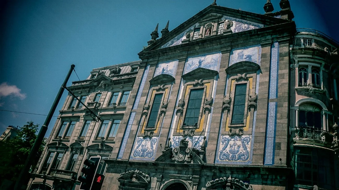 A building facade adorned with traditional blue and white azulejo tiles