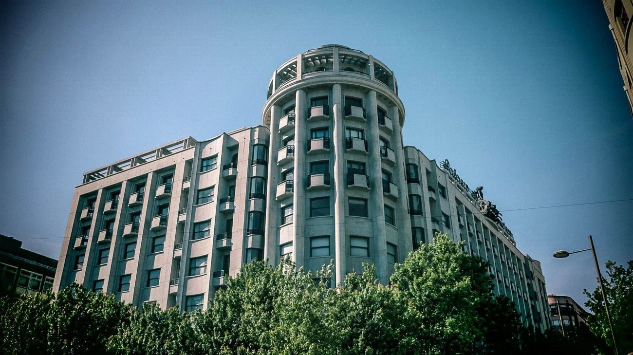 An art deco building with a cylindrical corner tower