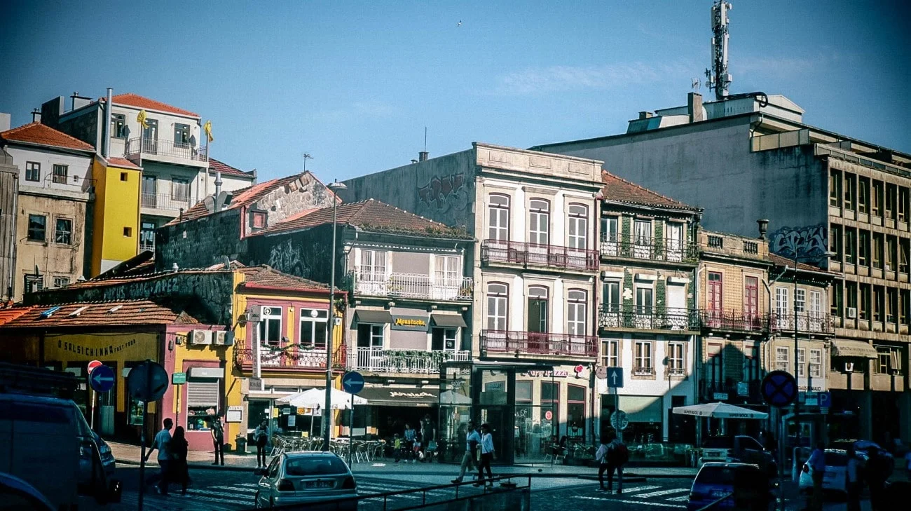 Colorful row of buildings with shops and cafes at street level