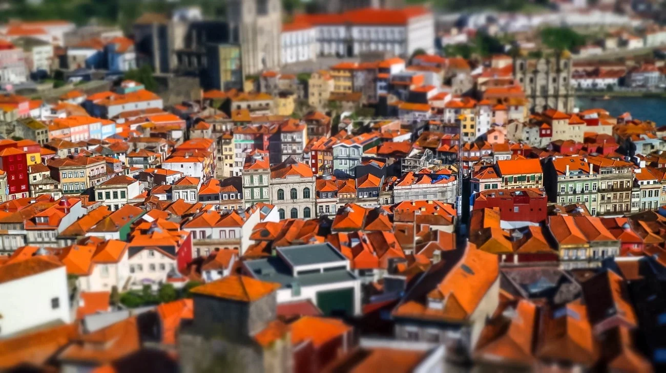 Tilt-shift view of Porto’s vibrant orange rooftops from the Clérigos Tower
