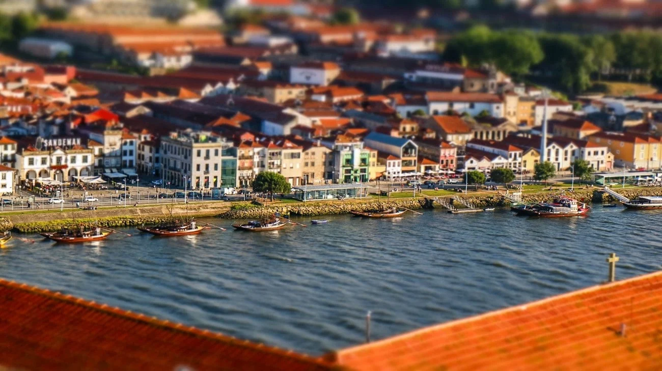 Tilt-shift view of Vila Nova de Gaia with Port wine boats on the Douro River
