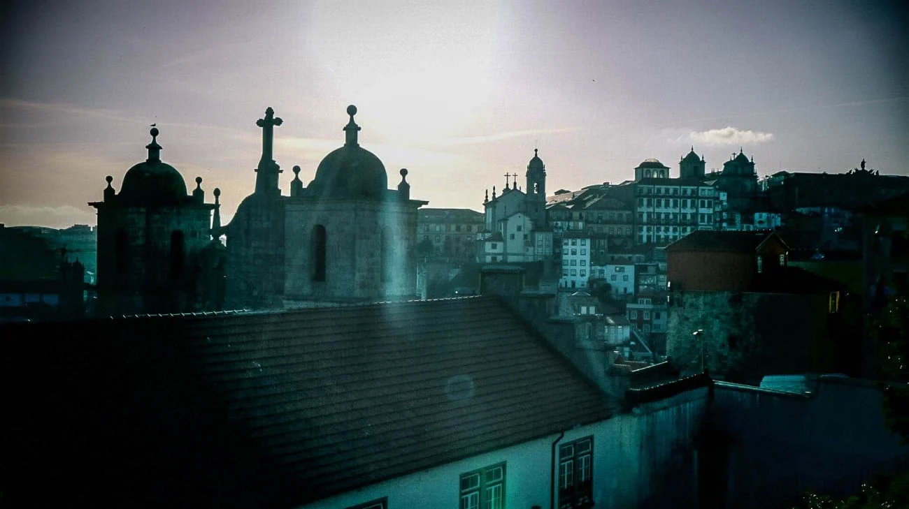 Church domes and crosses silhouetted against the sunset