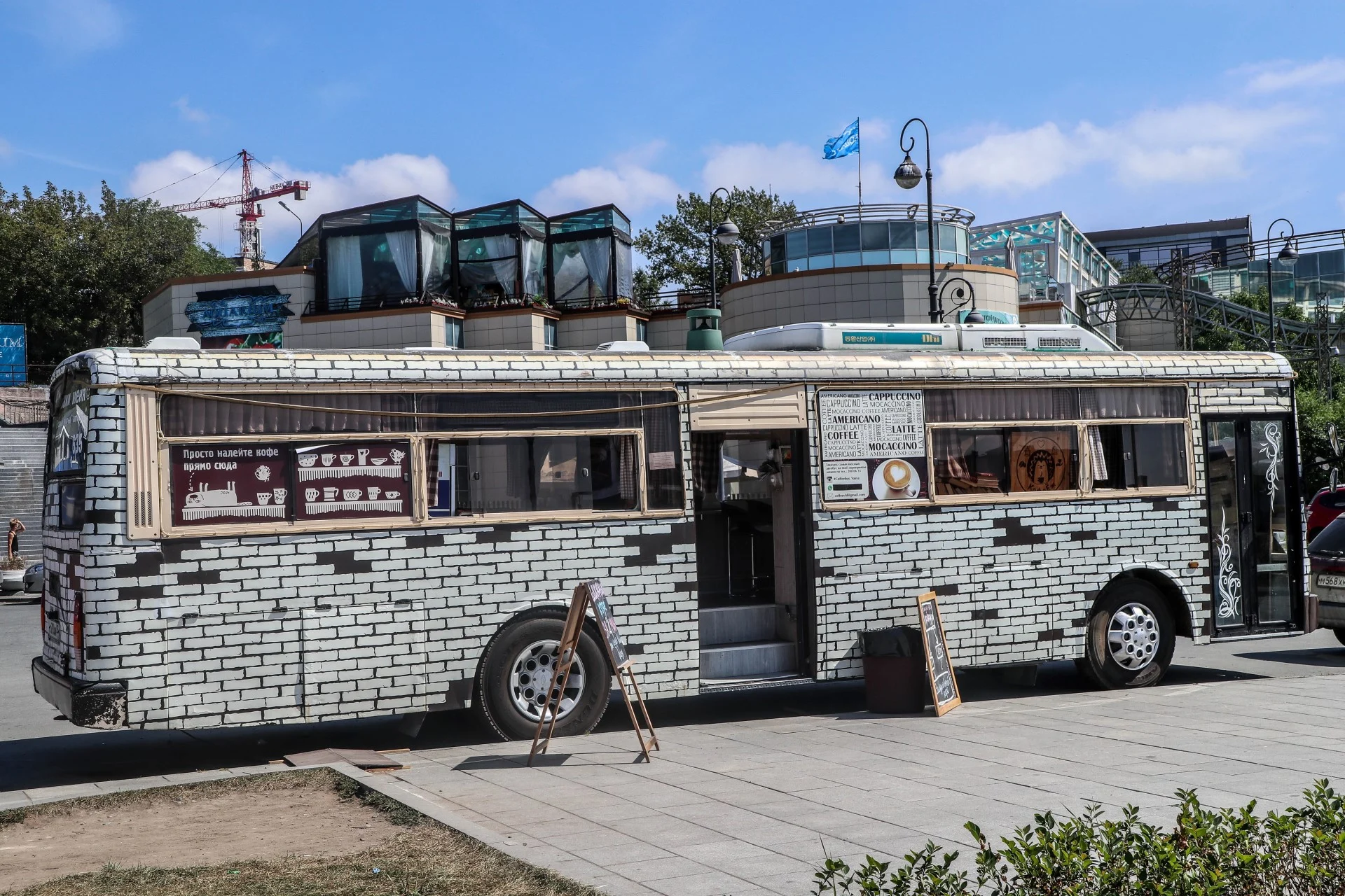 An old Soviet bus converted into a parked coffee bar
