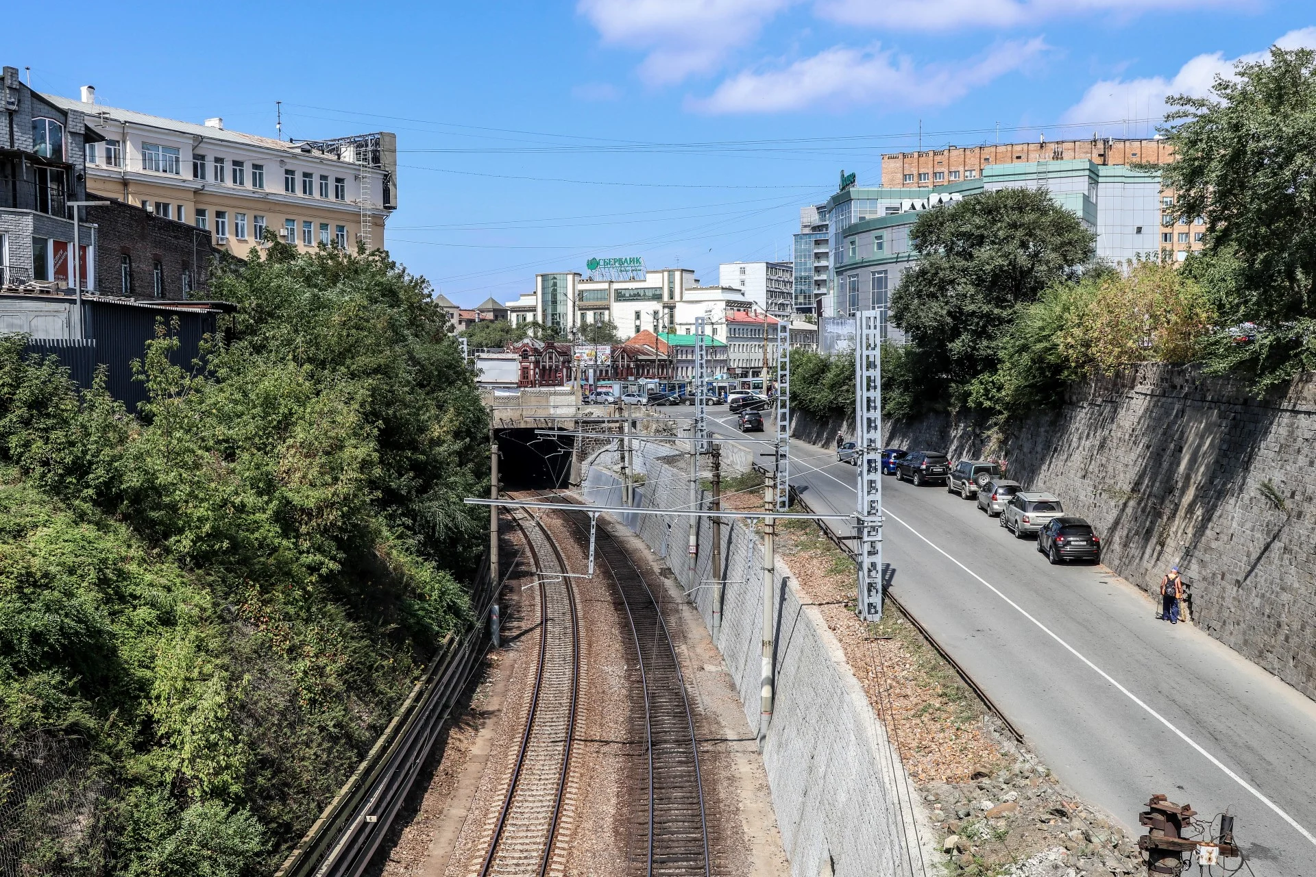 Trans-Siberian tracks emerge from a tunnel cut through the city’s hills