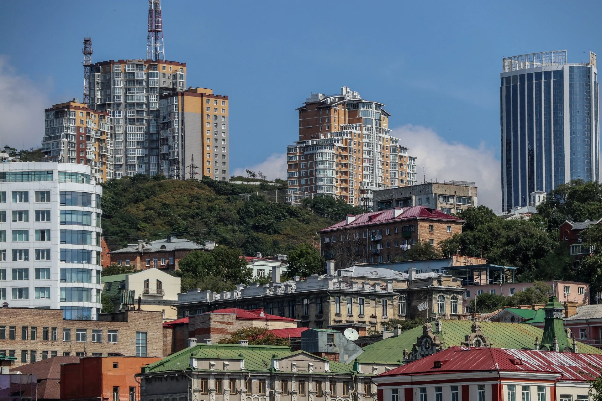 Soviet-era apartment blocks rise behind the city’s modernist forms