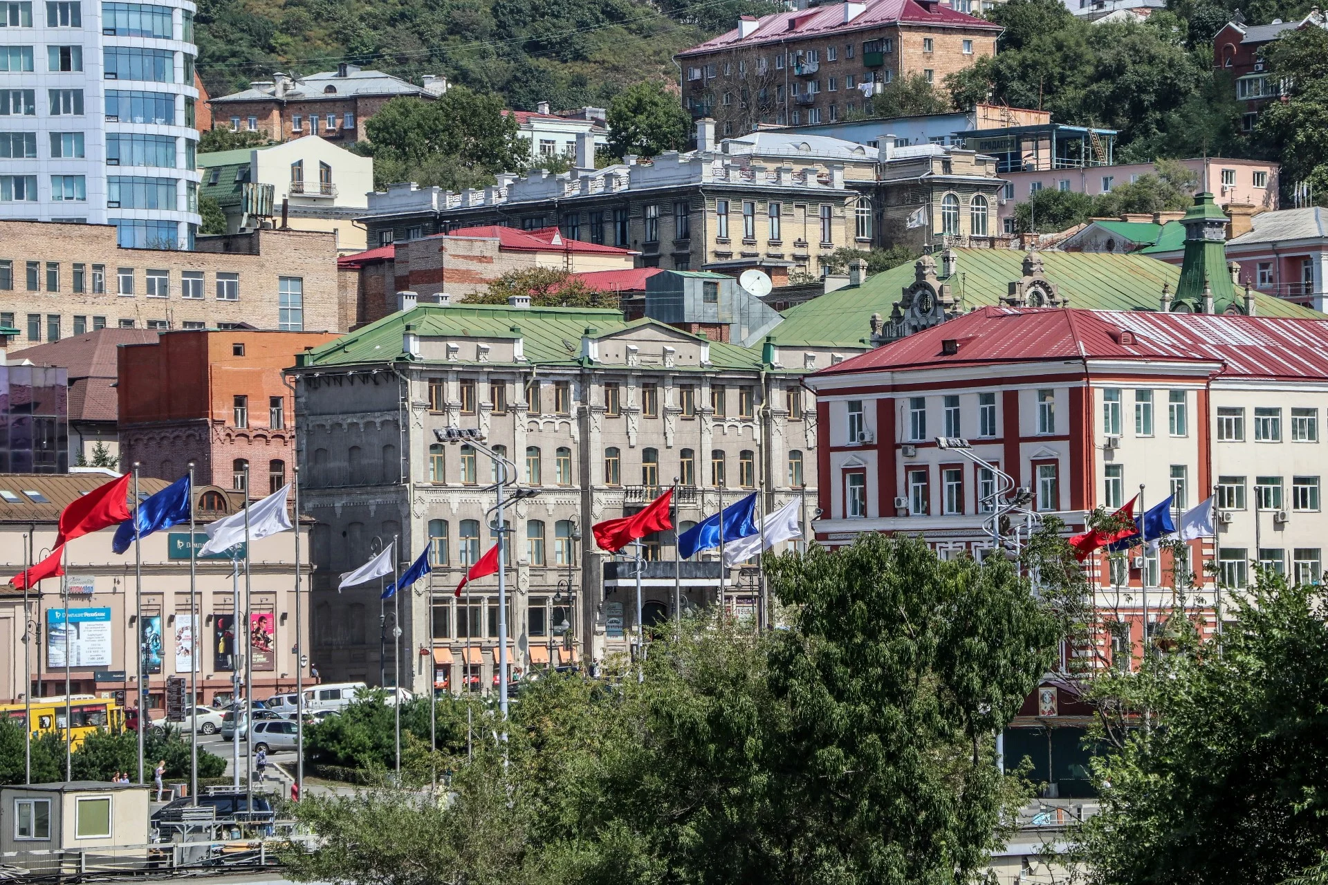 Ornate 19th-century facades along the lower town, with houses climbing the hill above